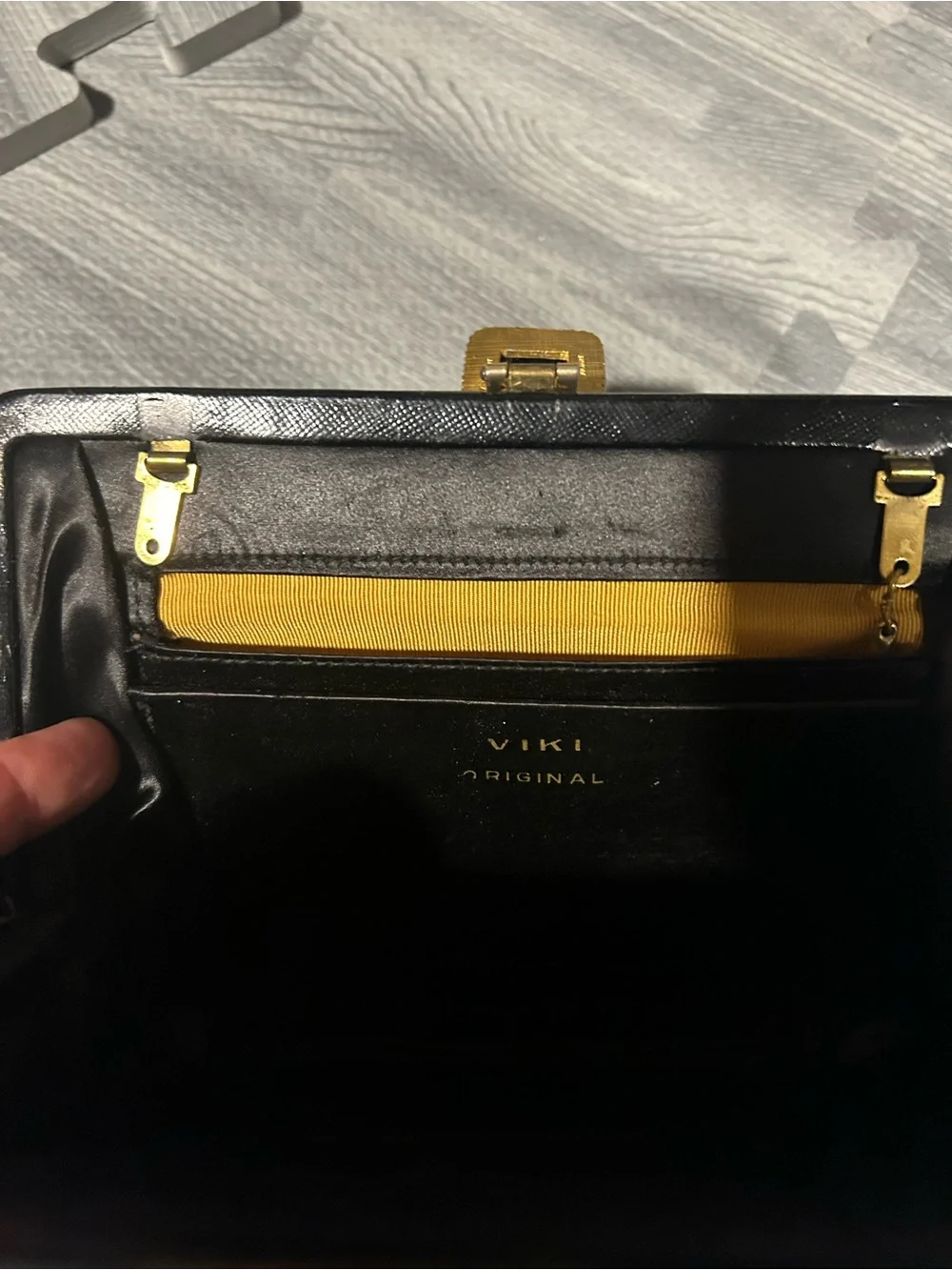 Elegant Black Evening Clutch with Decorative Gold Accent